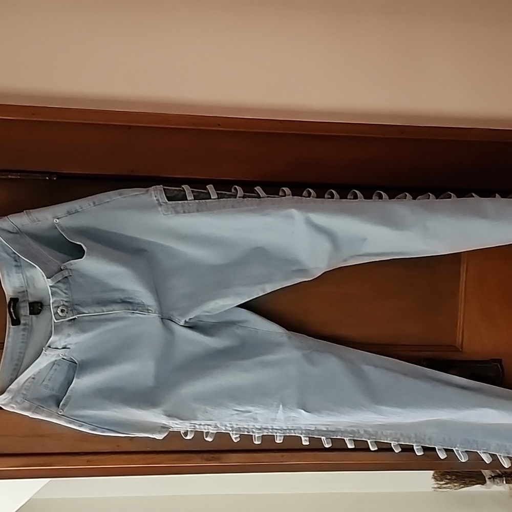 BRAND NEW....Womens light blue denim jeans. Size 16. Side leg open panel